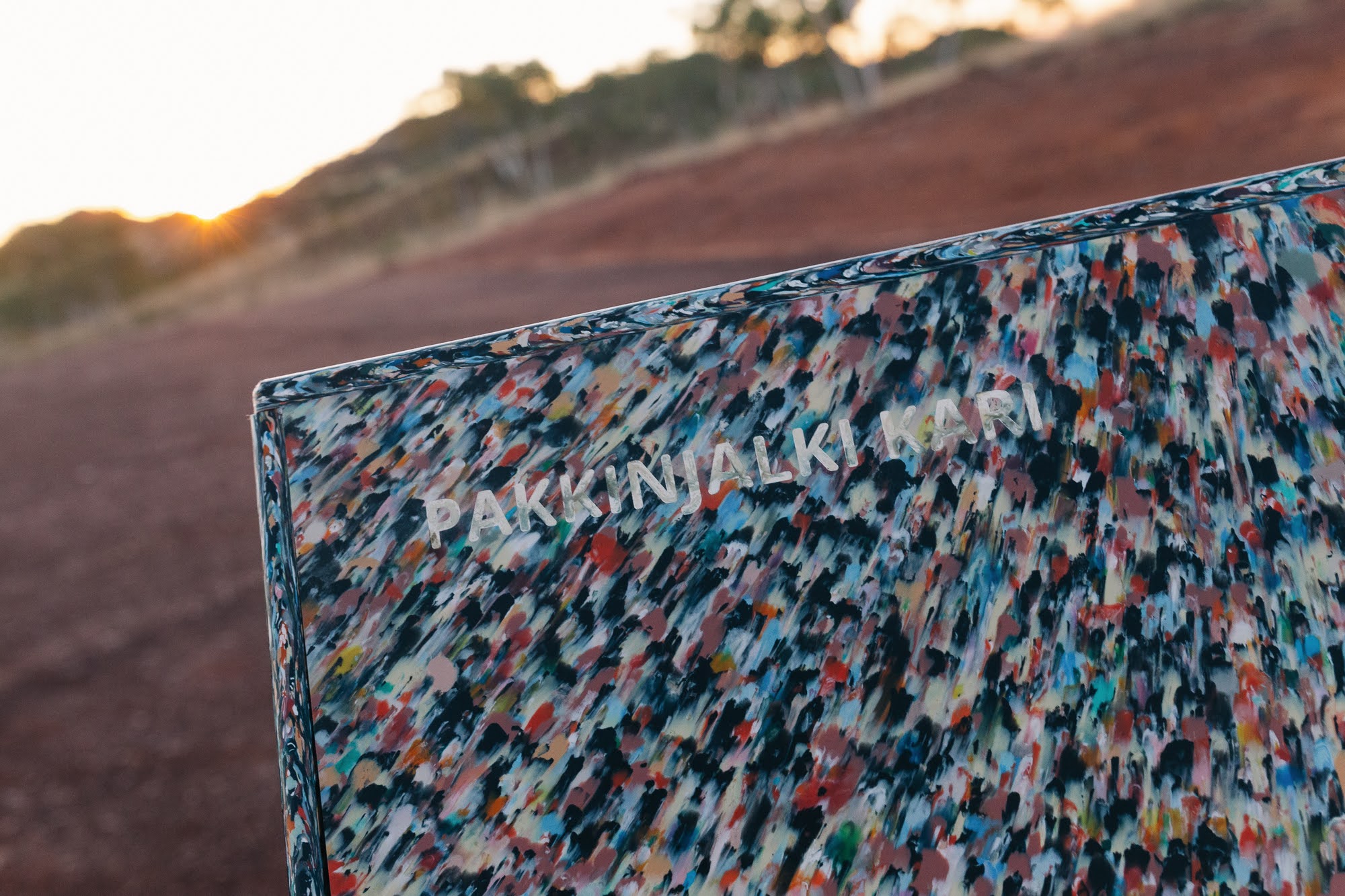 Pakkimjalki Kari engraved in recycled plastic